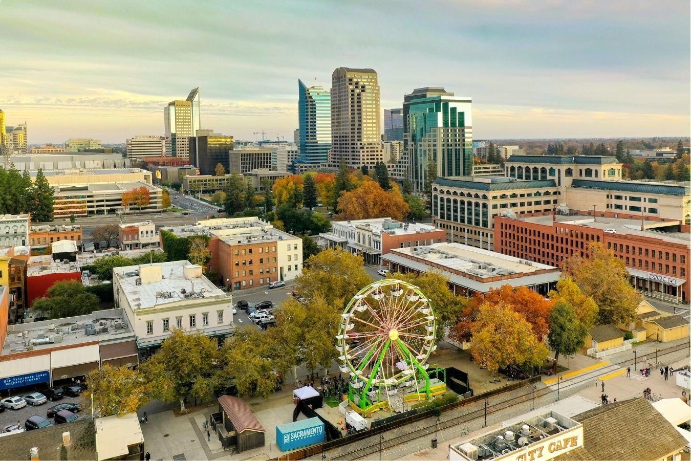 Aerial view of downtown Sacramento featuring the skyline and Ferris wheel in Old Sacramento during sunset Aerial view of downtown Sacramento featuring the skyline and Ferris wheel in Old Sacramento during sunset