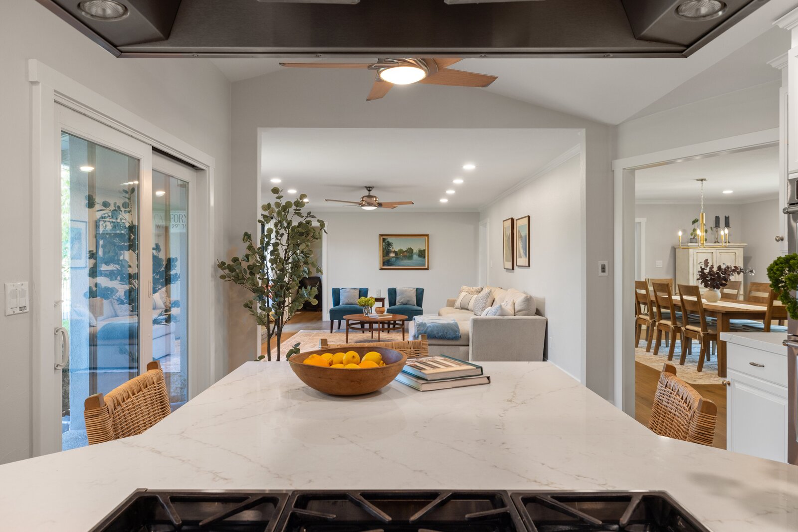 Open concept kitchen remodel in Sacramento, CA with island seating and dining room view