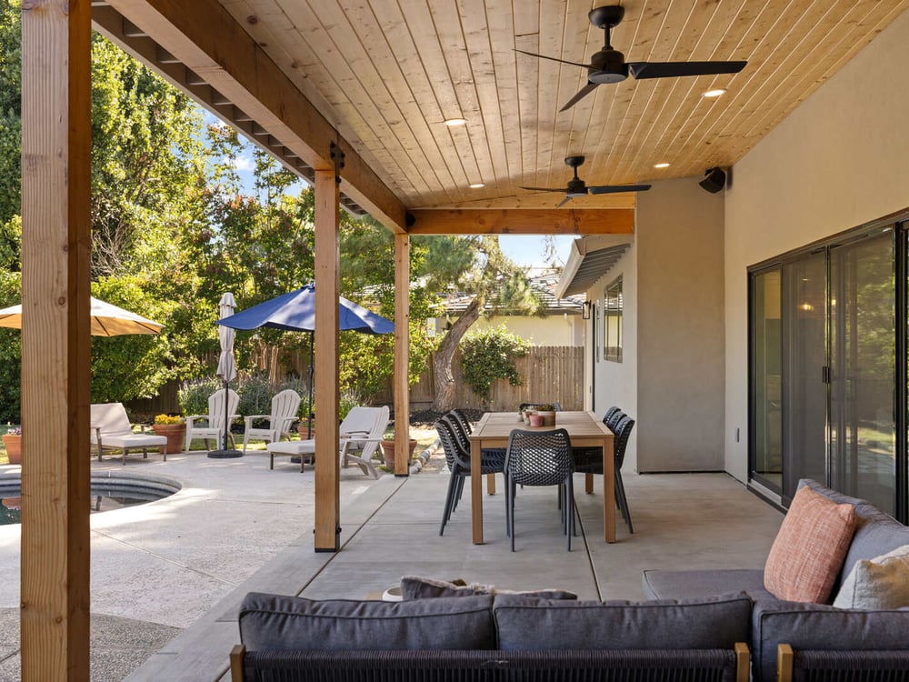 Stunning covered outdoor dining patio area in a Sacramento, CA home remodel