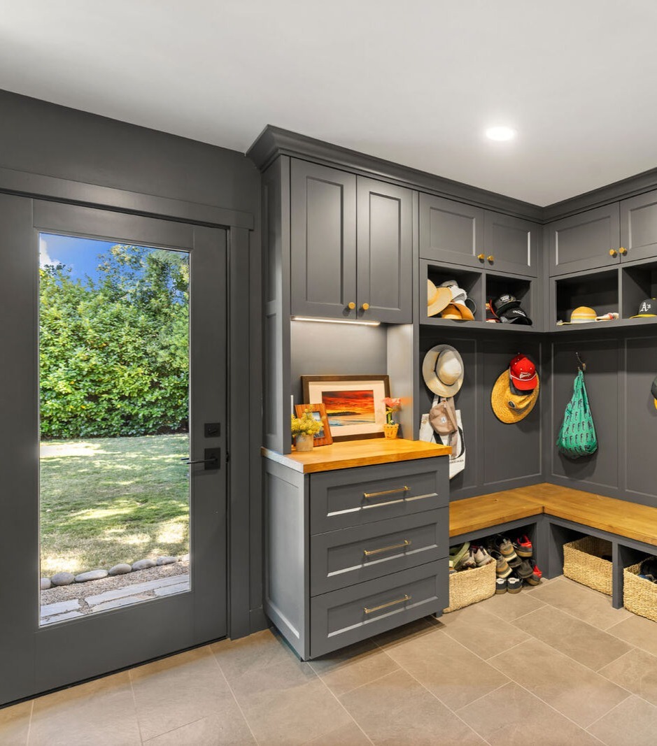 Custom mudroom in Sacramento CA with gray cabinets and wood bench storage Custom mudroom in Sacramento CA with gray cabinets and wood bench storage