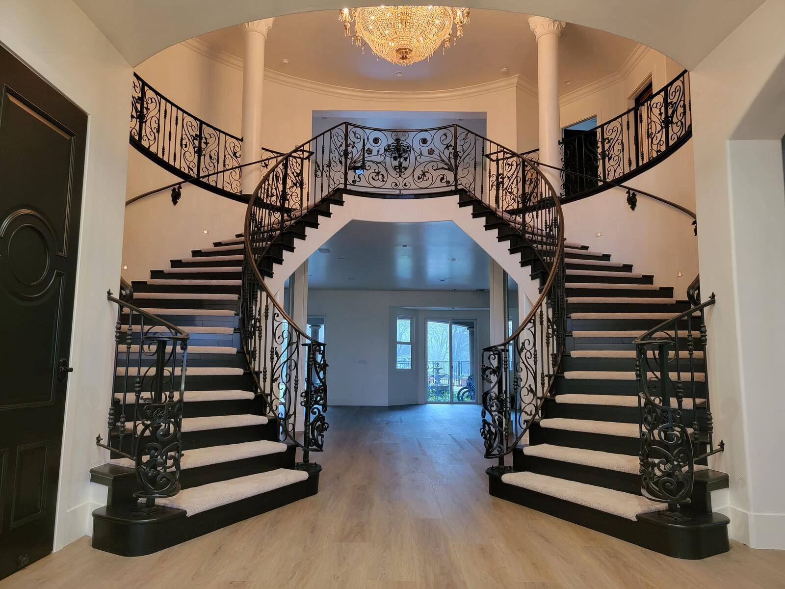 Elegant staircase remodel with black railings and custom dual staircases by H&H Builds, Sacramento, CA Elegant staircase remodel with black railings and custom dual staircases by H&H Builds, Sacramento, CA