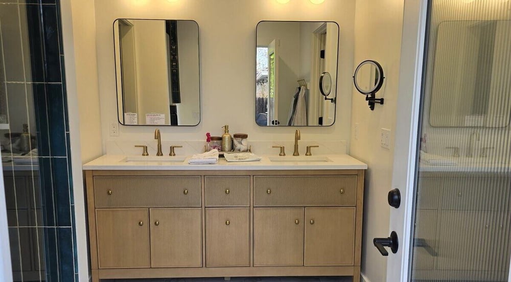 Modern bathroom remodel featuring marble hexagonal flooring, double vanity, and glass shower door by H&amp;H Builds, Sacramento, CA