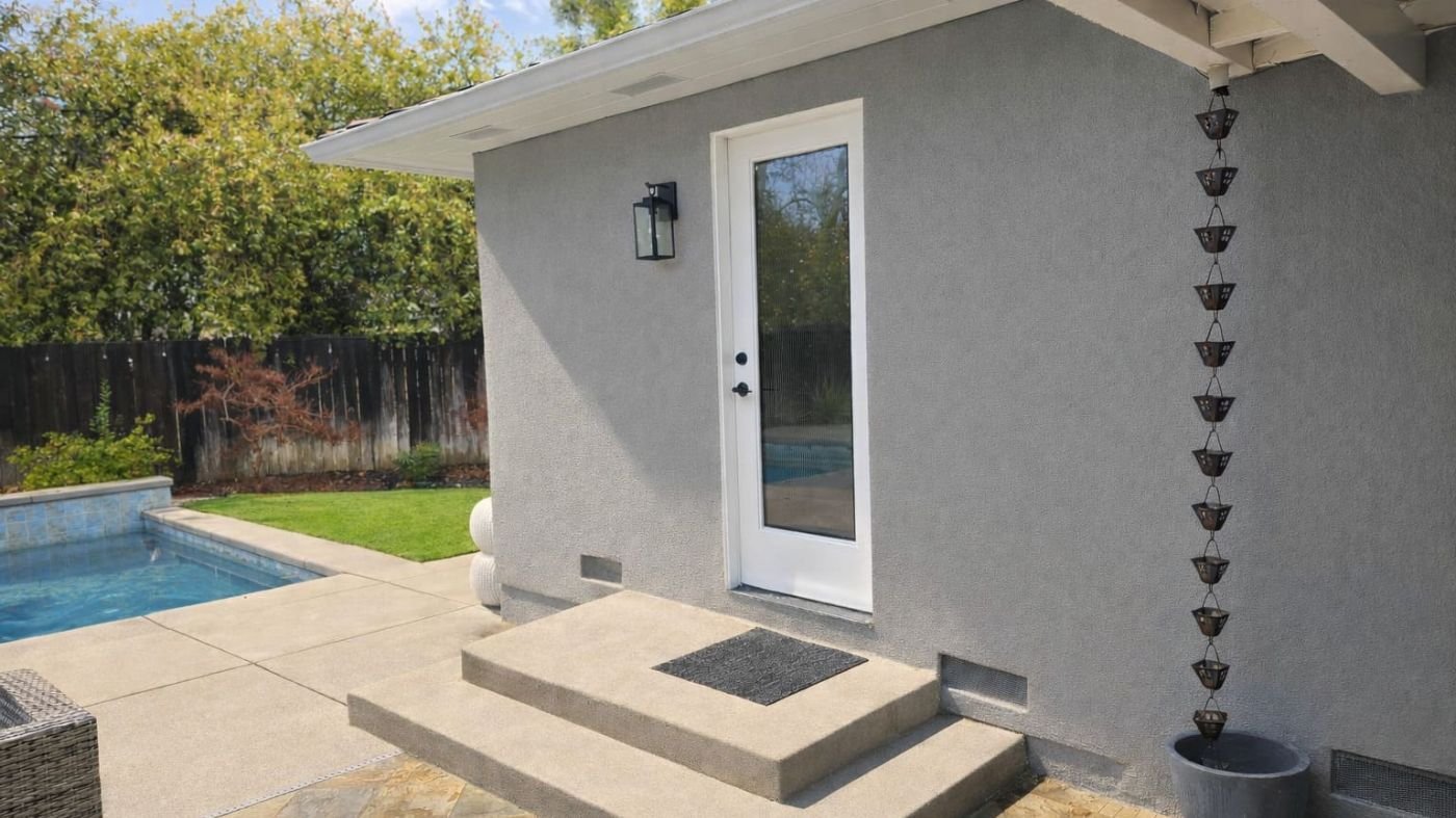 Modern backyard renovation with a pool, patio, and gray guest house addition in Sacramento, CA, by H&H Builds-1