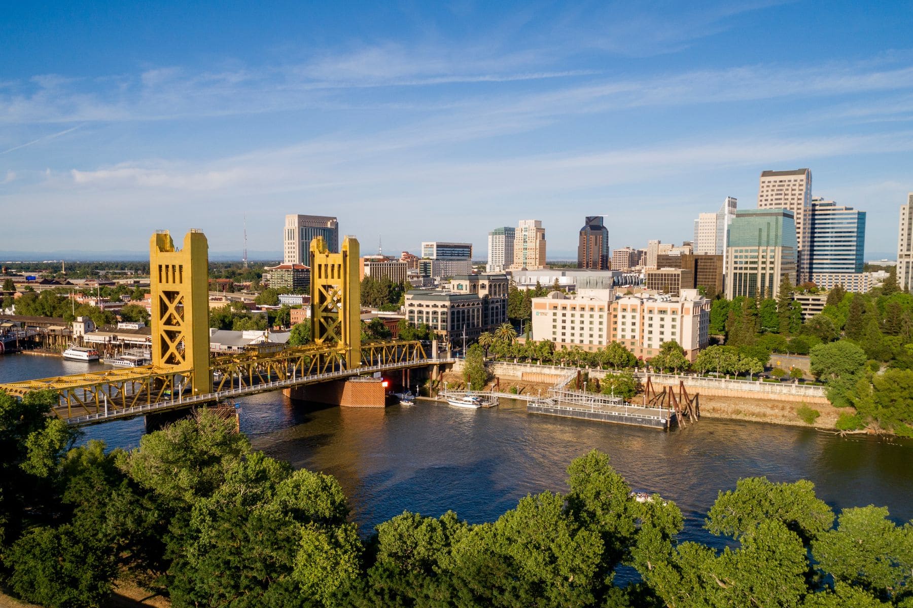 Sacramento skyline with Tower Bridge over the river and downtown buildings at sunset Sacramento skyline with Tower Bridge over the river and downtown buildings at sunset