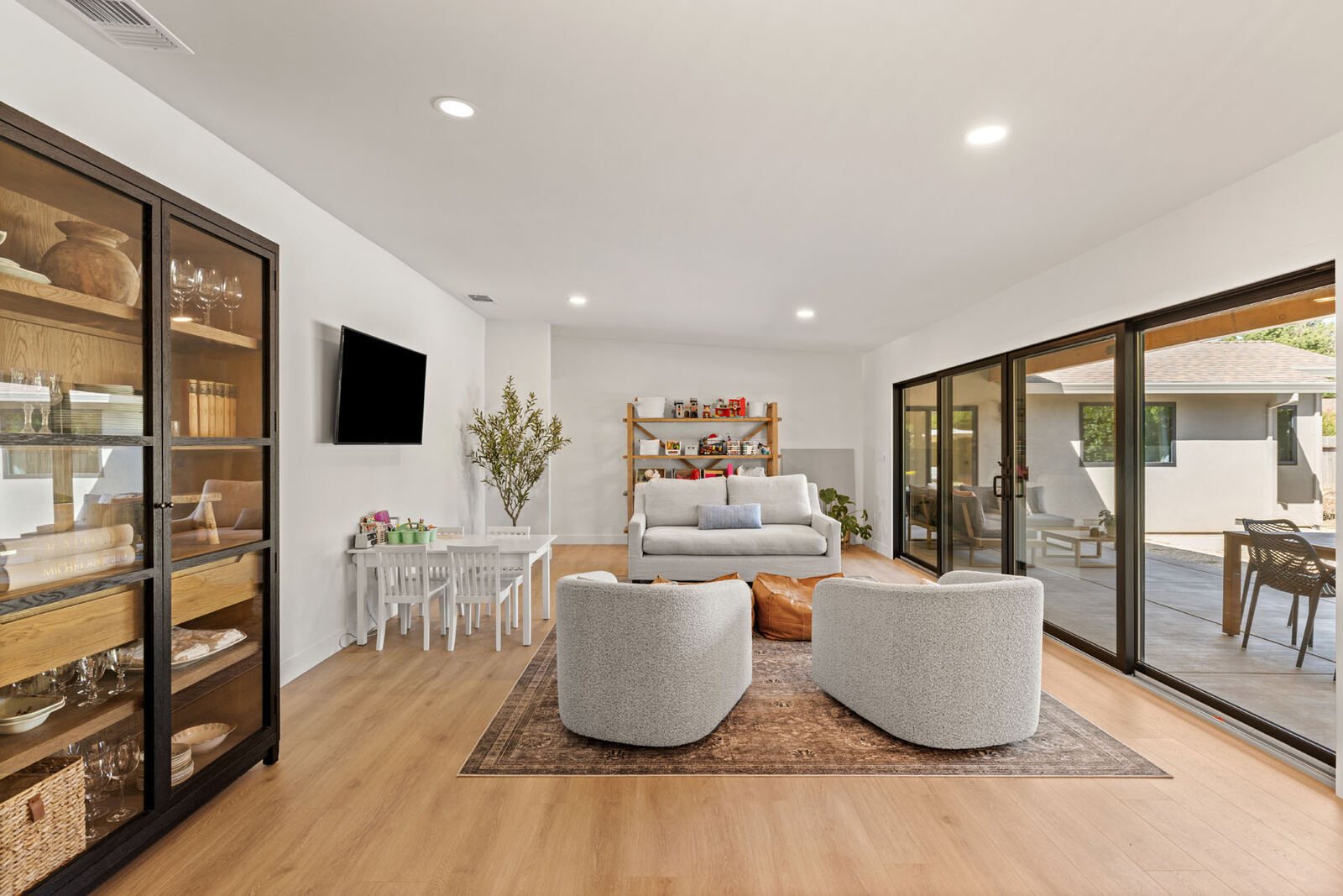 Open Sacramento, CA living room home remodel with modern sliding glass doors