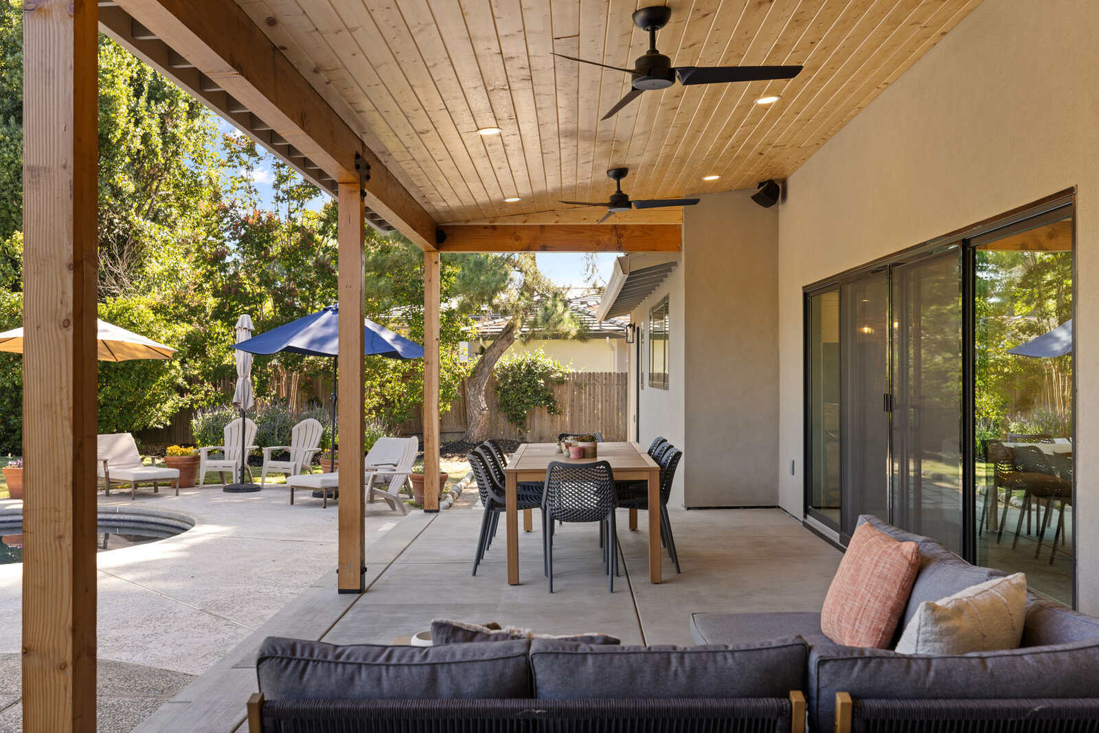 Stunning covered outdoor dining patio area in a Sacramento, CA home remodel
