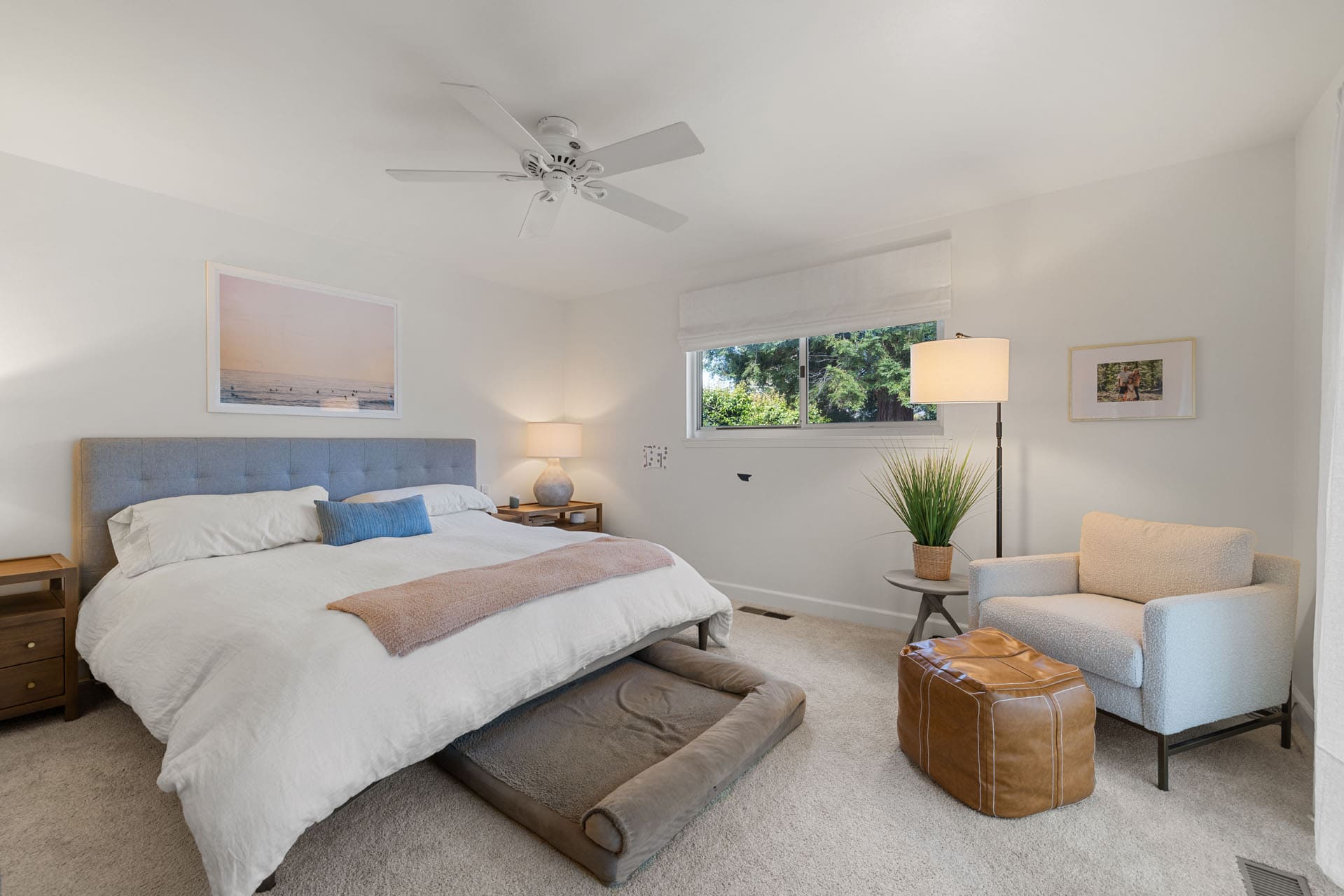 BEFORE cozy Sacramento bedroom with neutral tones, a large bed, and a soft reading corner