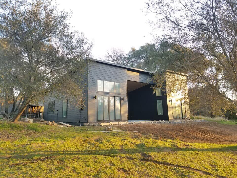 Contemporary black custom home exterior with spacious windows, Sacramento, CA project by H&H Builds