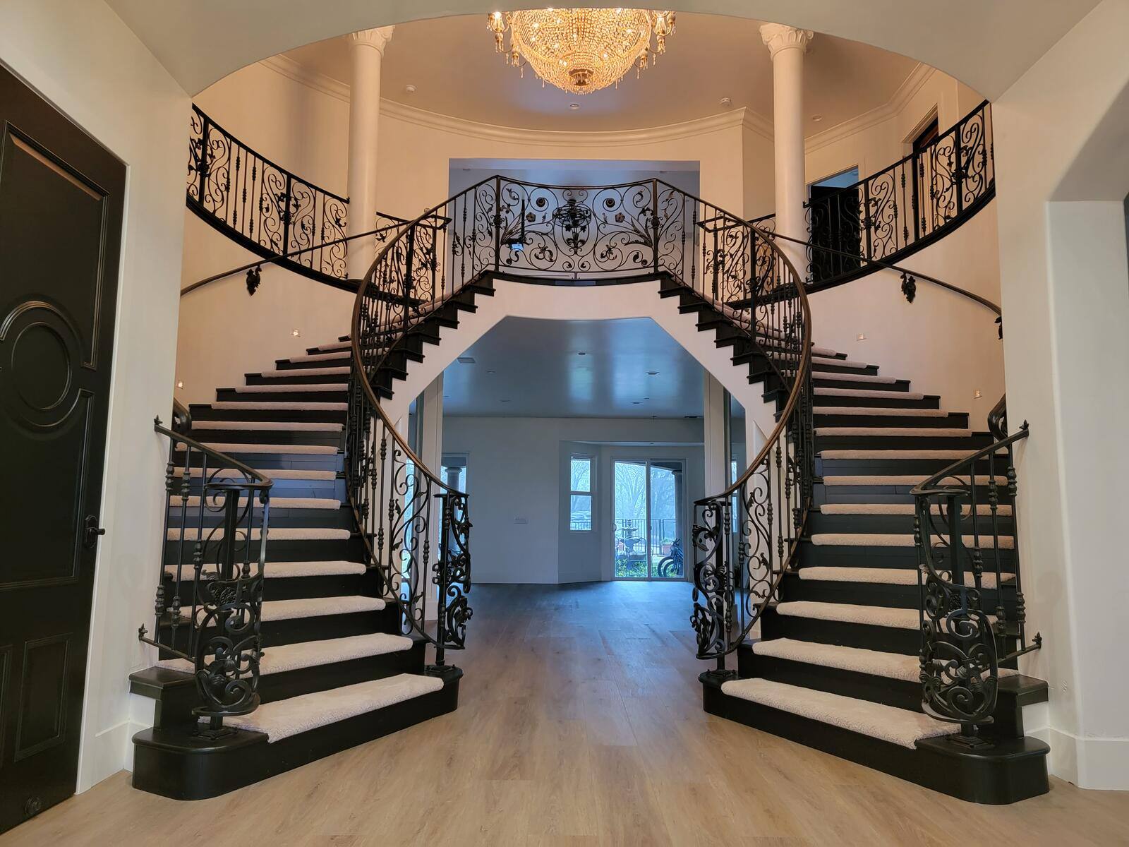 Elegant staircase remodel with black railings and custom dual staircases by H&H Builds, Sacramento, CA