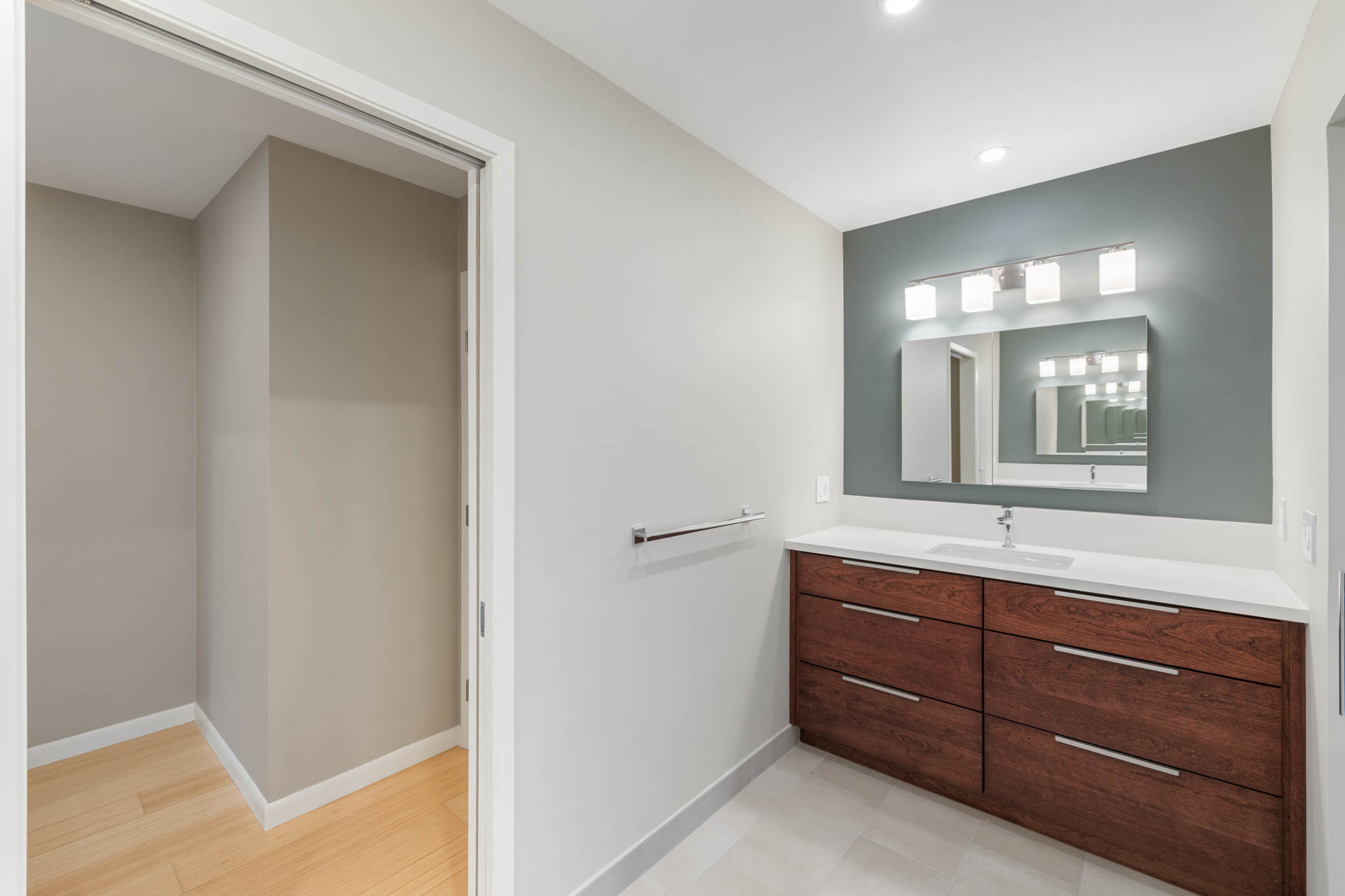 Wide view of remodeled Sacramento bathroom with clean finishes and bamboo flooring